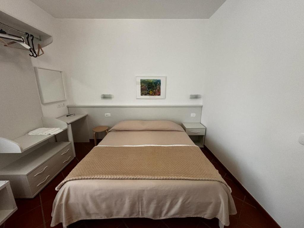 Кровать или кровати в номере La Nuova Dimora B&B