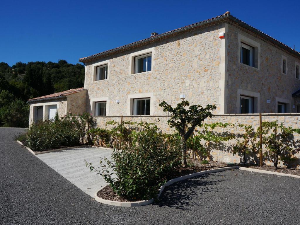 a building with a fence in front of it at Magnificent Villa in Saint Ambroix with Private Pool in Saint-Ambroix