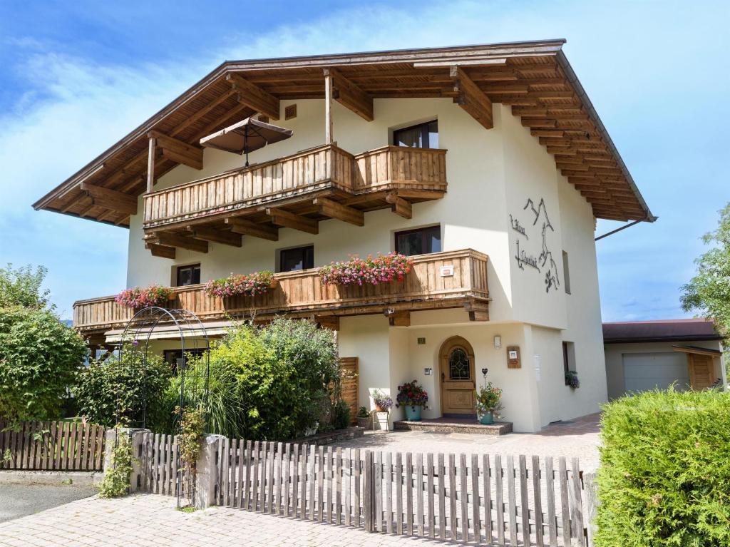 a house with a balcony on top of it at Haus Chorblick in Westendorf