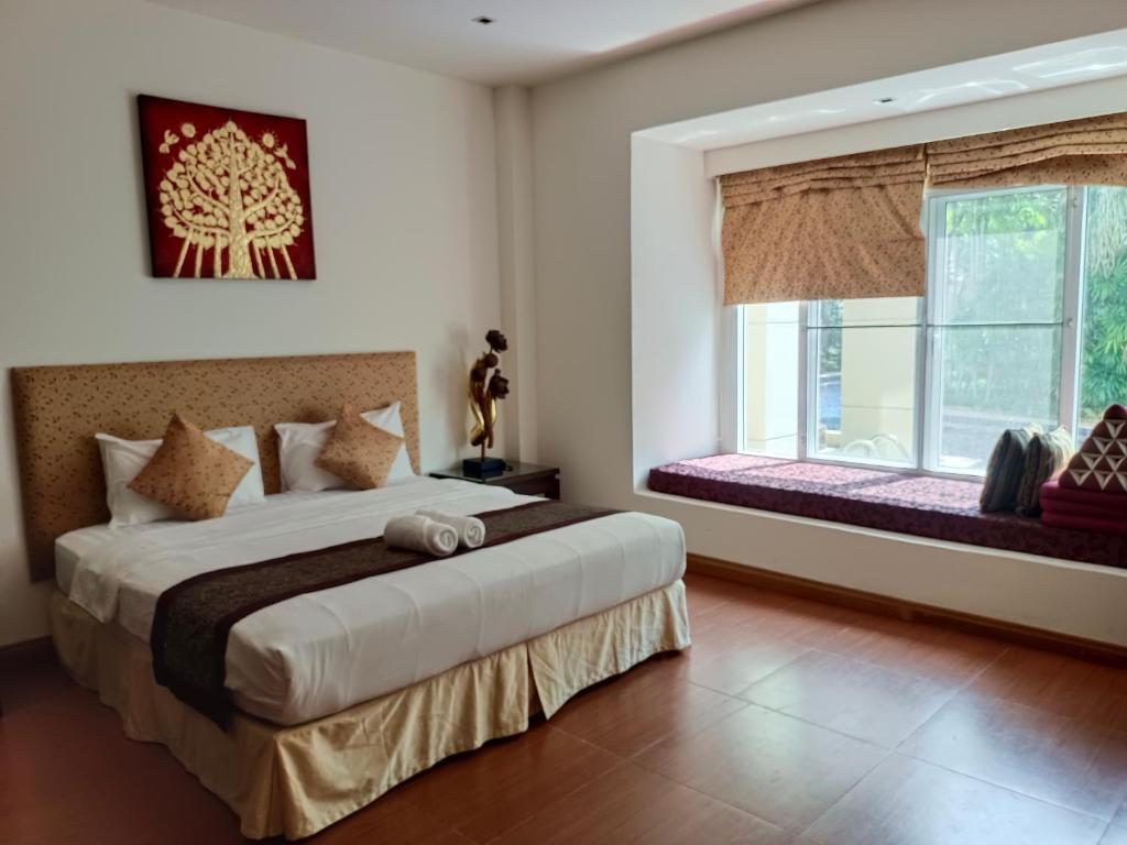 Postel nebo postele na pokoji v ubytování Hua Hin Blue Lagoon