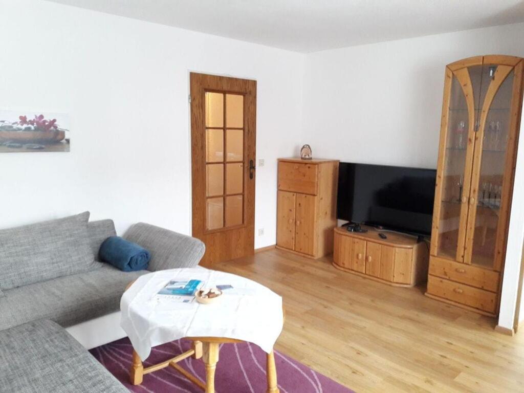 a living room with a couch and a tv at Holiday apartment Rosi Denz in Bad Au