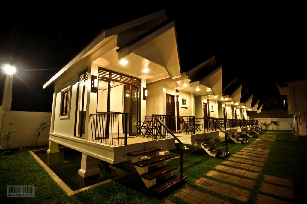 a house is lit up at night at Cleon Villas Pension in Puerto Princesa City