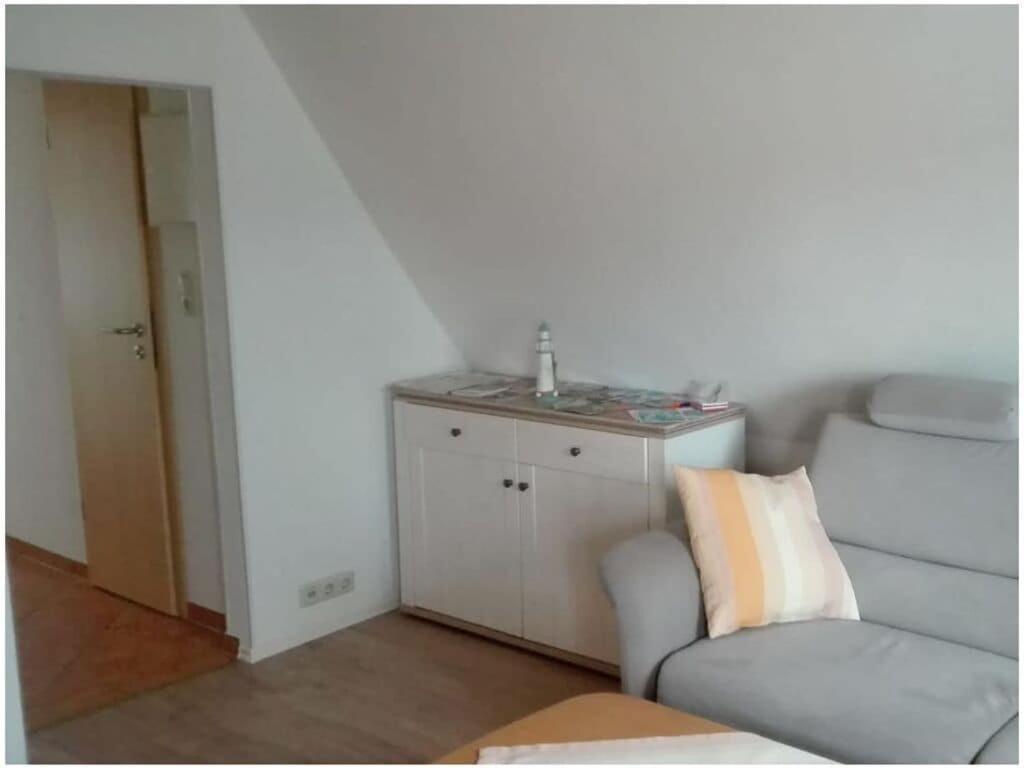 a living room with a couch and a table at Holiday apartment Grohnert in Lübeck