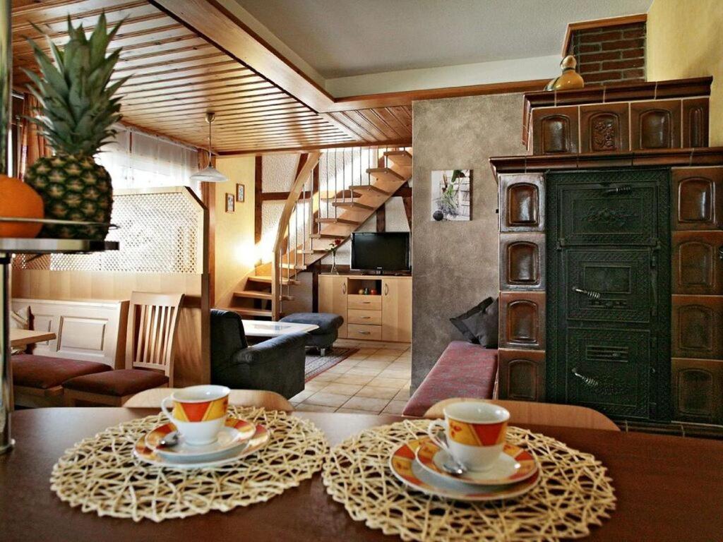two cups of coffee on a table in a room at Appealing apartment in Motten in Motten
