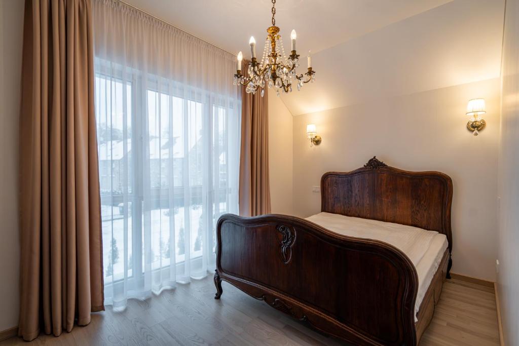 Postel nebo postele na pokoji v ubytování Cottage by the Baltic