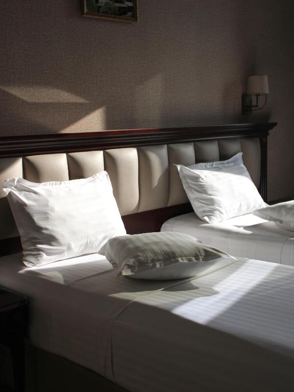 Postel nebo postele na pokoji v ubytování Konyak Hotel