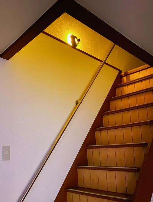 a staircase with a light on top of it at Pokémon Sleep 宝可梦的家 in Osaka