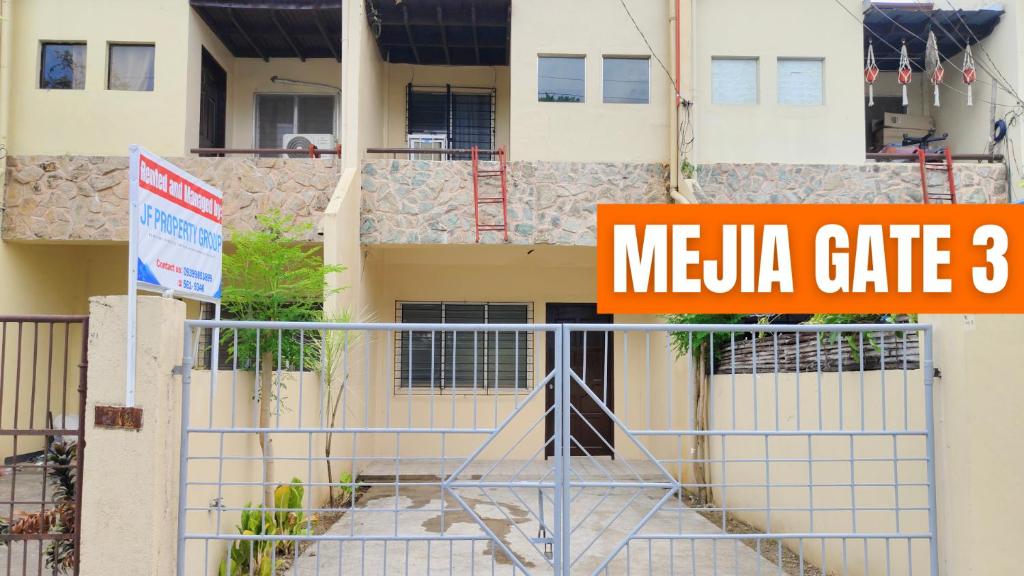 a sign that reads meula gate in front of a building at Mejia Gate 3 in Ormoc