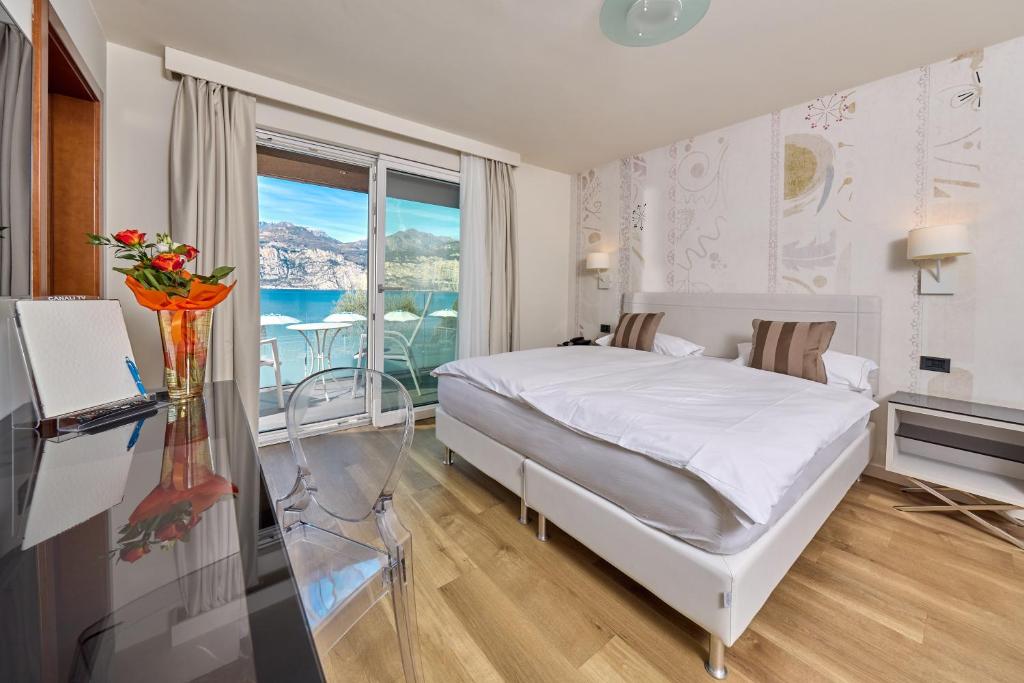 Postel nebo postele na pokoji v ubytování Hotel Capri