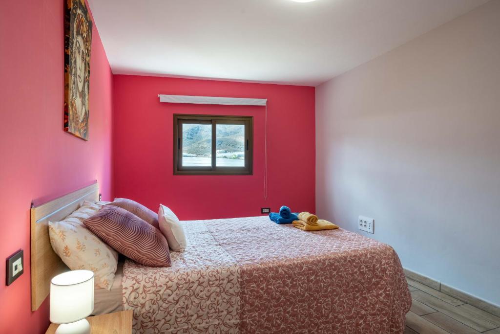 Postel nebo postele na pokoji v ubytování Las Fajanas de Gáldar