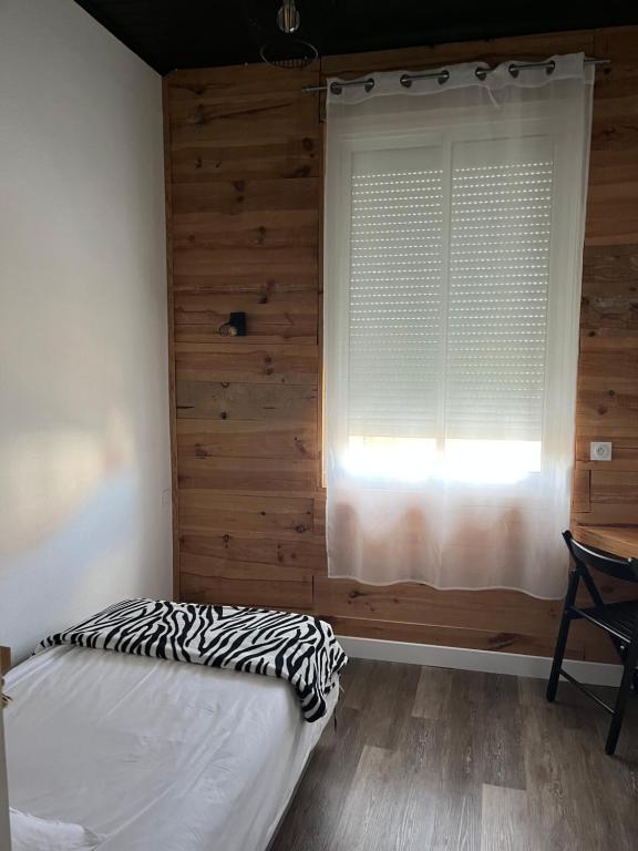Postel nebo postele na pokoji v ubytování Hôtel Bellevue