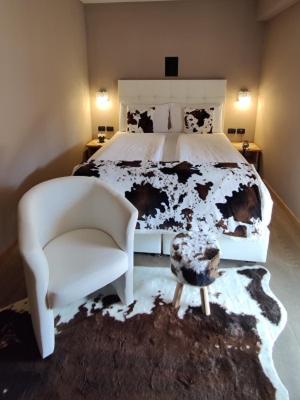 Postel nebo postele na pokoji v ubytování Hotel Astoria