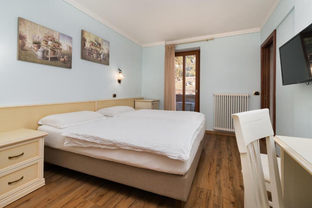 Postel nebo postele na pokoji v ubytování Hotel Opinione Dimora Storica