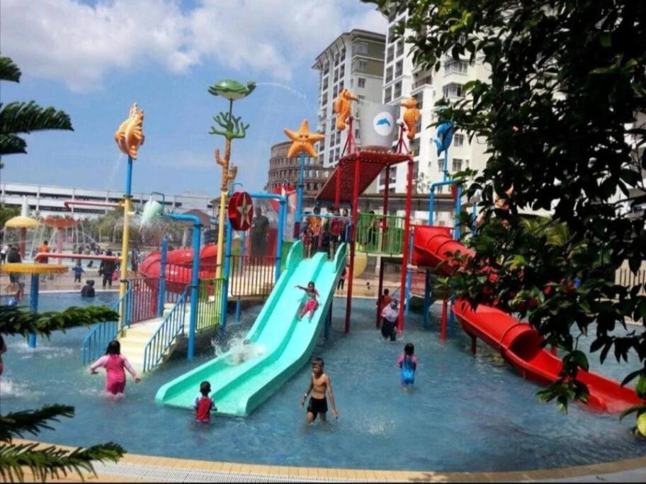 a group of people playing in a water park at Bayou Bliss@Bayou Lagoon in Ayer Keroh