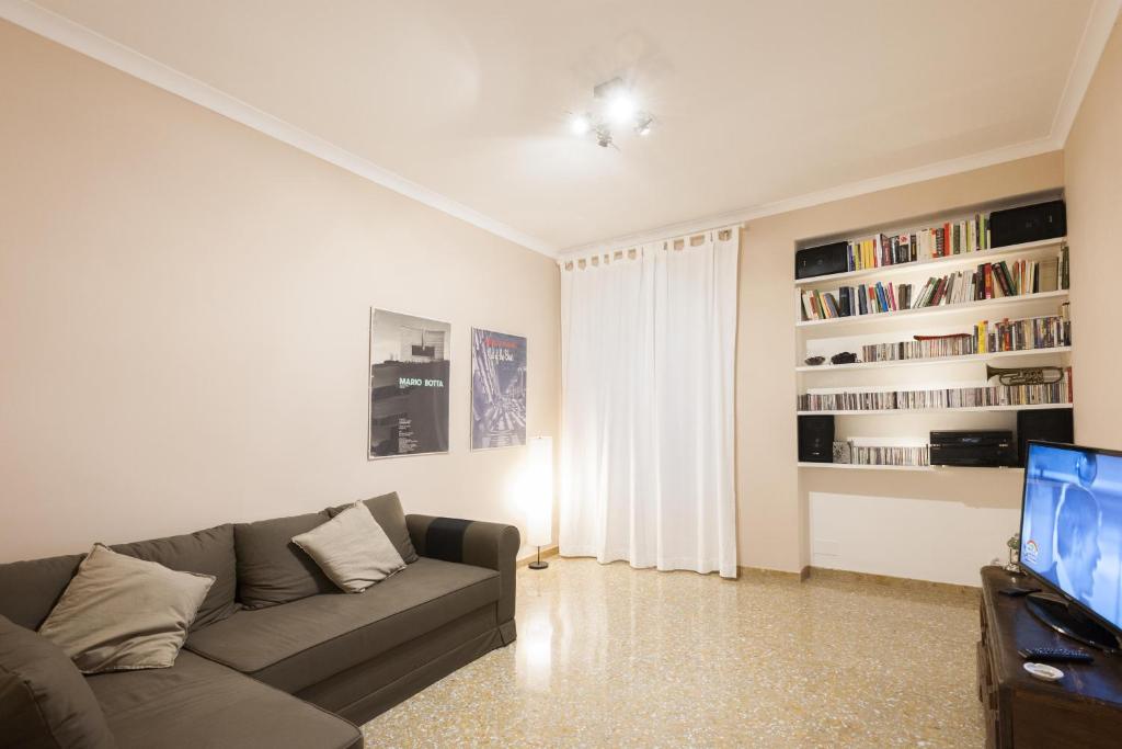 a living room with a couch and a tv at Vatican flat in Rome
