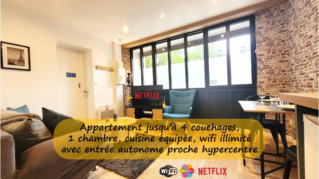 a living room with a yellow sign on a couch at L'industriel - Tout confort in Saint-Brieuc