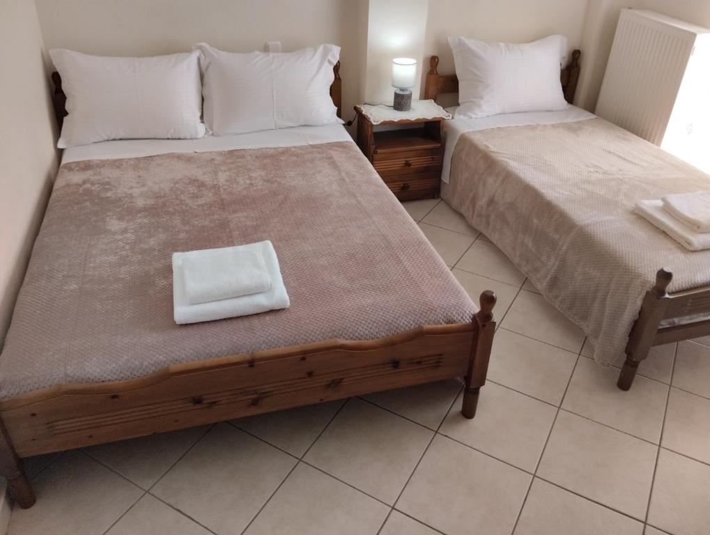 Postel nebo postele na pokoji v ubytování Lina's House Pramanta