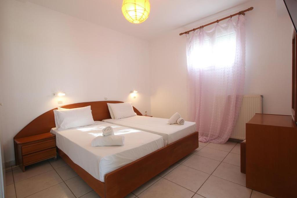 Postel nebo postele na pokoji v ubytování S&C Kosmos Beach Resort