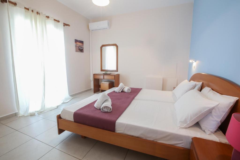 Postel nebo postele na pokoji v ubytování S&C Kosmos Beach Resort