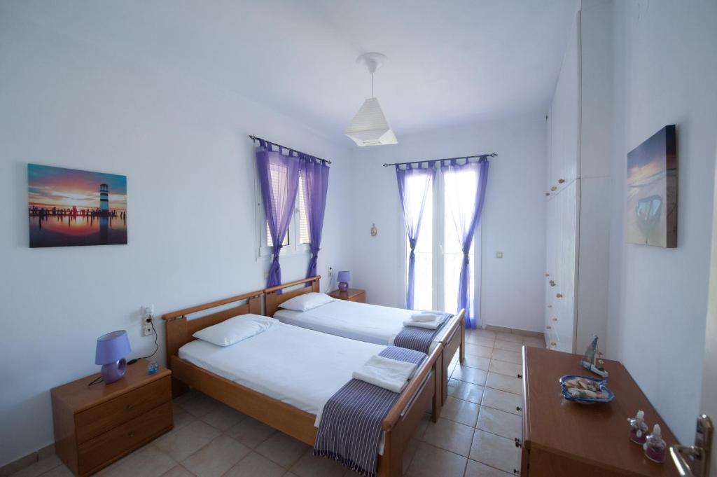 Postel nebo postele na pokoji v ubytování S&C Kosmos Beach Resort