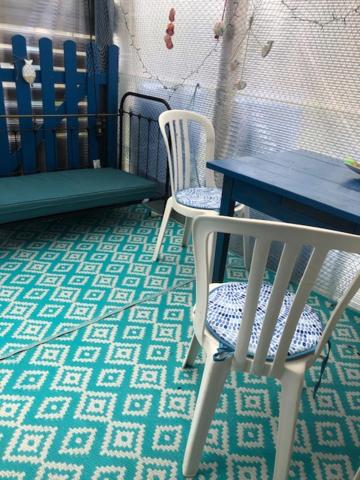 a table and two chairs and a table and a table at chambre océan in Pleurtuit