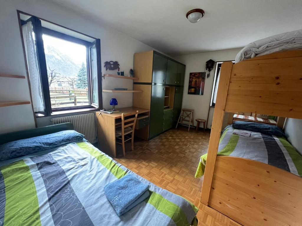 Postel nebo postele na pokoji v ubytování Casa Ognano (Pellizzano)