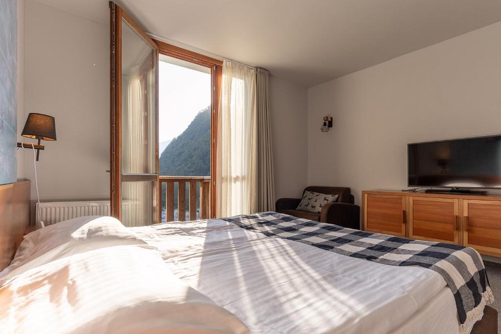 Postel nebo postele na pokoji v ubytování Hotel Boka