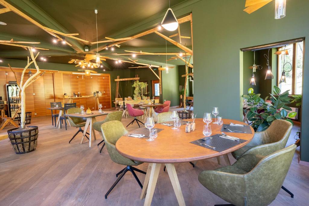 a dining room with a table and chairs at Hotel Boka in Bovec