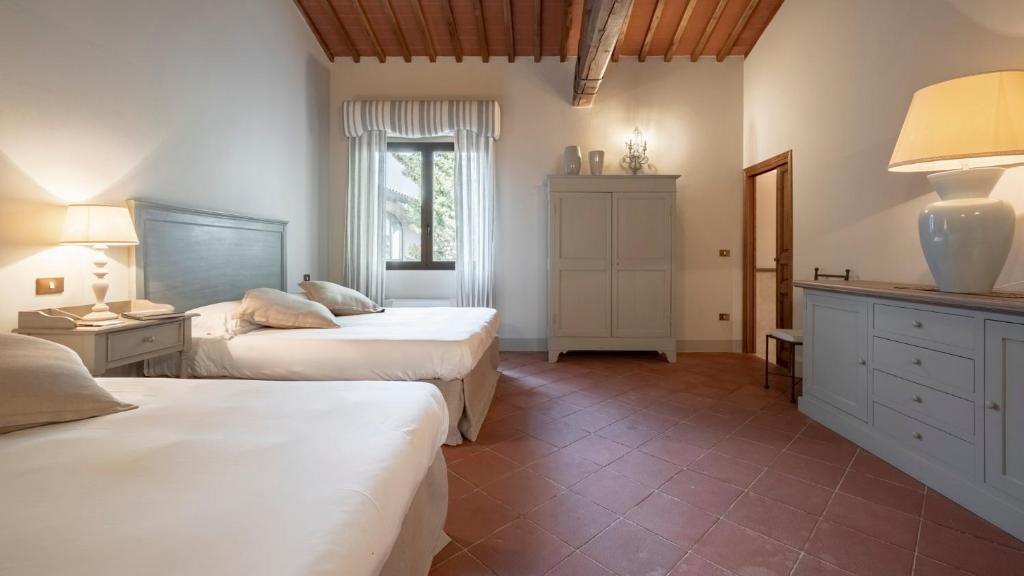 Postel nebo postele na pokoji v ubytování Villa La Selva Wine Resort