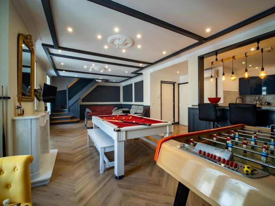 a living room with a pool table and foosball at Duplex Jeanne d'Arc Billard Baby en option Escape Game Logements Insolites in Nancy