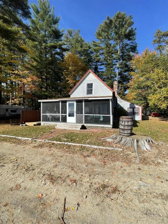 a white house with a lot of windows at 1901 HOUSE LIMIT 10 cottage in North Sebago
