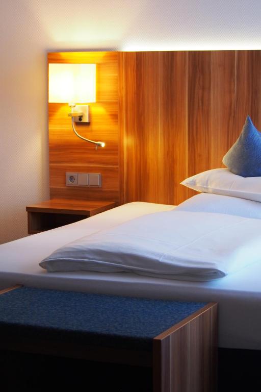 Postel nebo postele na pokoji v ubytování Best Western Blankenburg Hotel