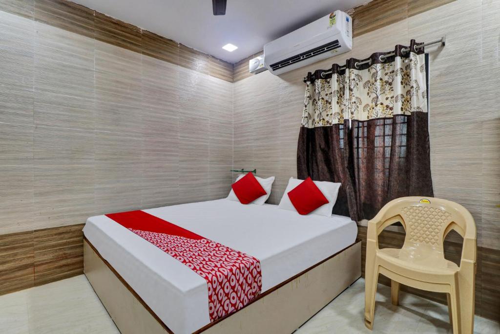 En eller flere senger på et rom på Hotel Vallabha Residency