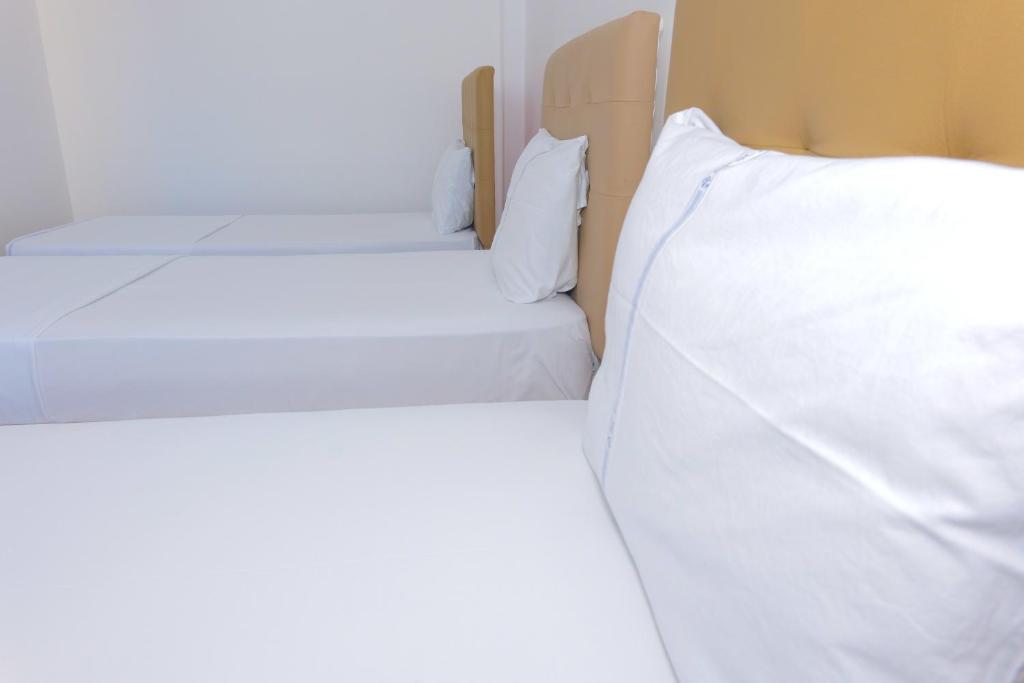 Postel nebo postele na pokoji v ubytování AFA Hotel