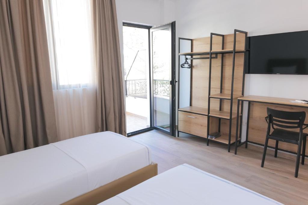 Postel nebo postele na pokoji v ubytování AFA Hotel