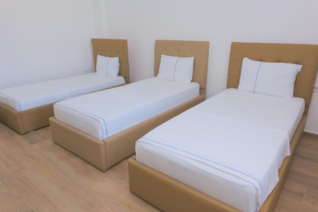 Postel nebo postele na pokoji v ubytování AFA Hotel