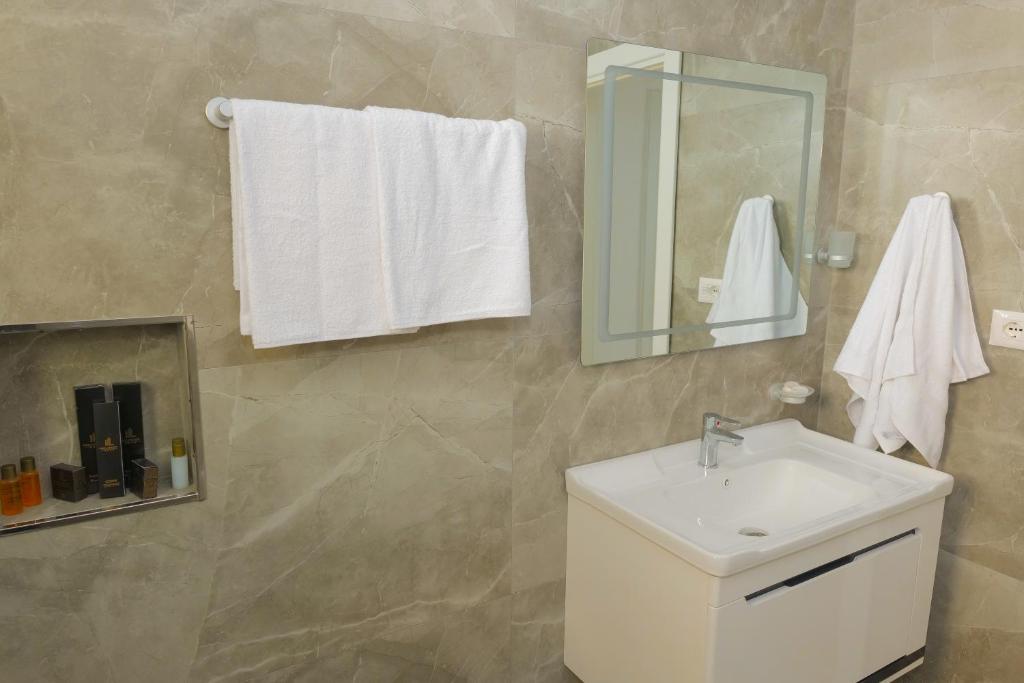 Koupelna v ubytování AFA Hotel
