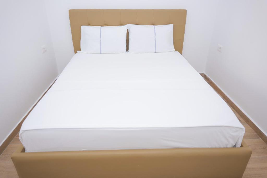 Postel nebo postele na pokoji v ubytování AFA Hotel