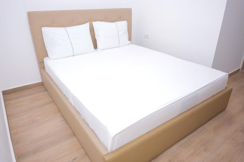 Postel nebo postele na pokoji v ubytování AFA Hotel