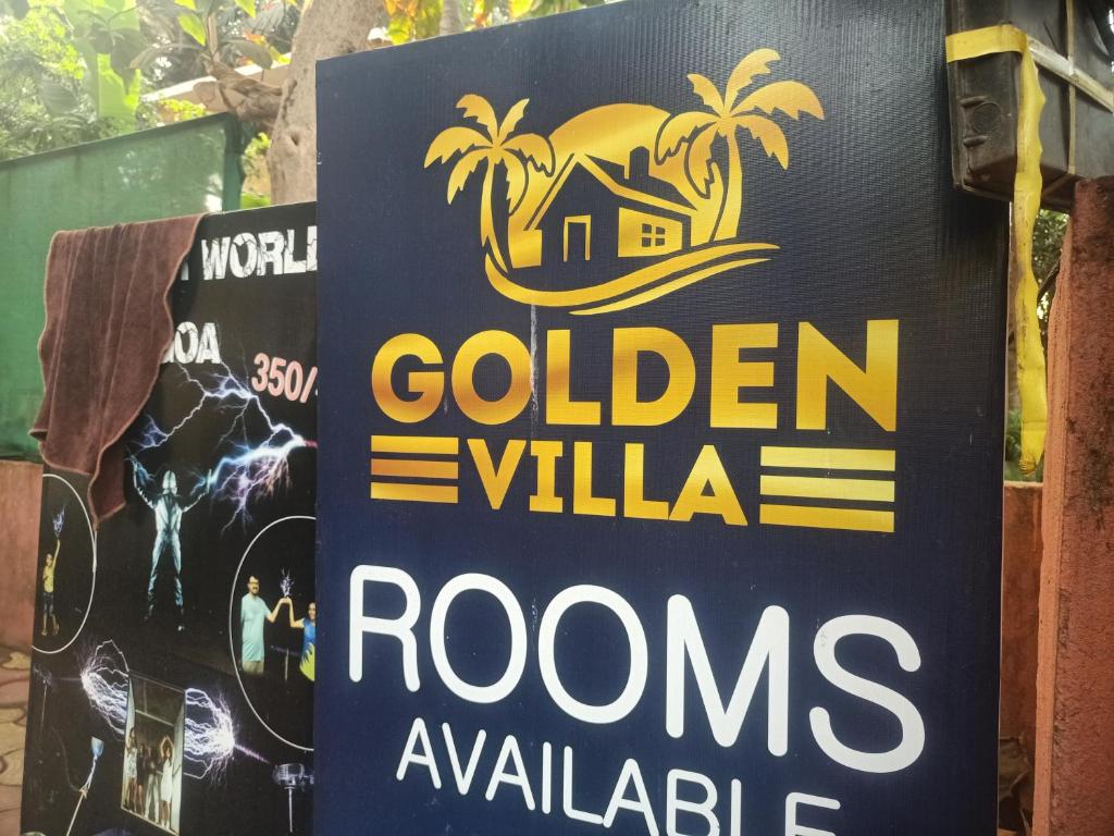 a sign for a golden villas rooms available at Golden villa in Calangute