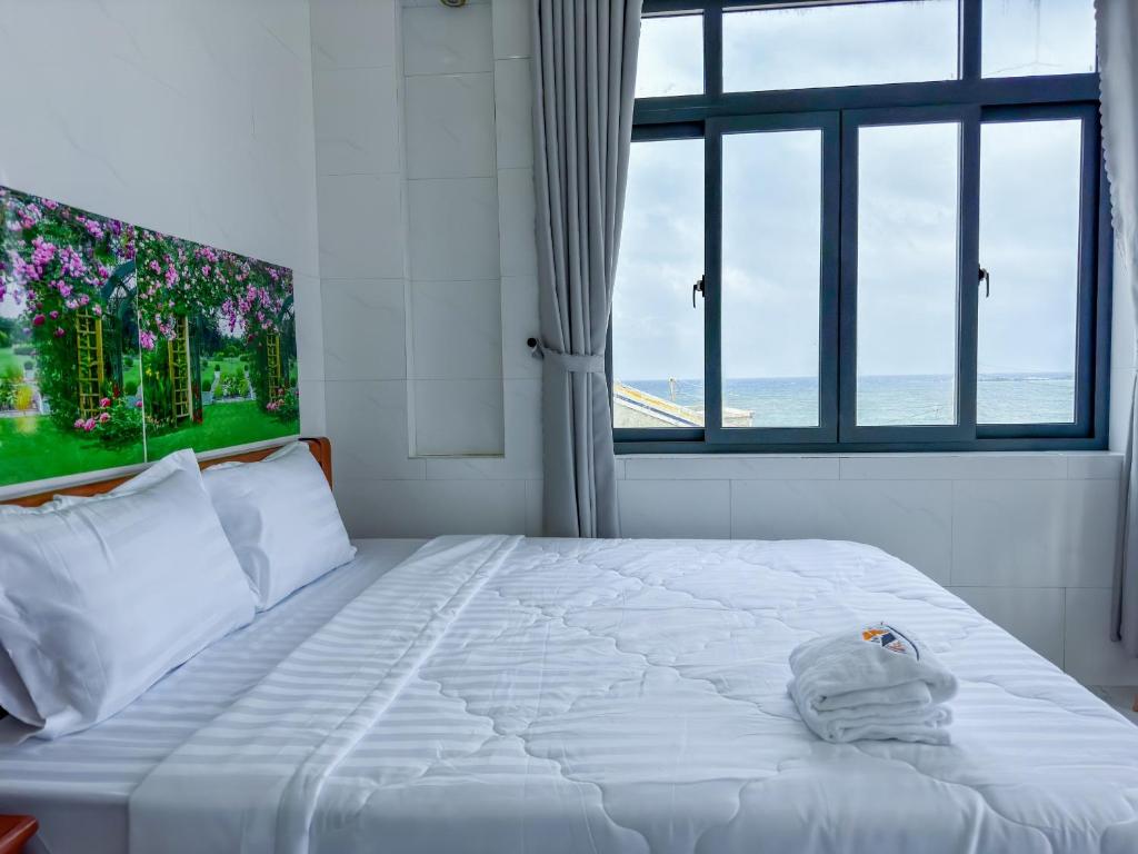 Postel nebo postele na pokoji v ubytování Homestay Tiến Đạt