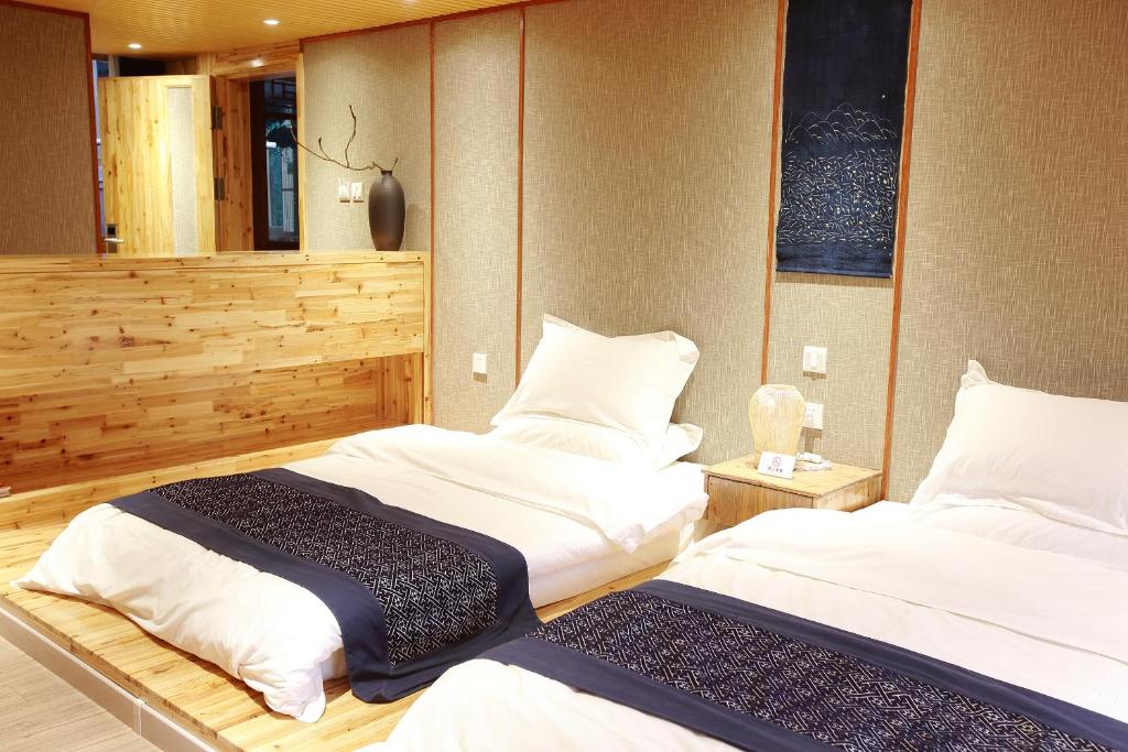 Postel nebo postele na pokoji v ubytování Tong Sang Art Hotel