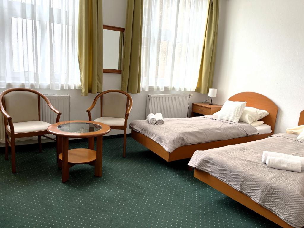 Postel nebo postele na pokoji v ubytování Broadway City Guesthouse