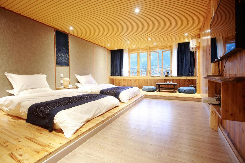Postel nebo postele na pokoji v ubytování Tong Sang Art Hotel