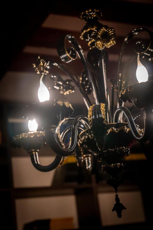 a close up of a chandelier with lights at Palazzo San Luca in Venice