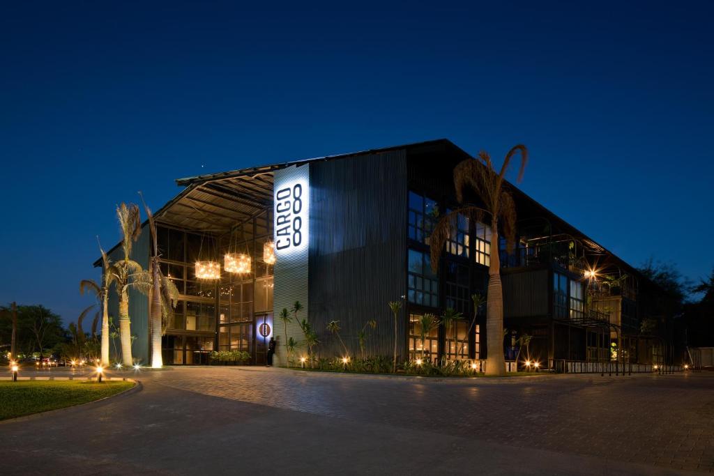 a large building with a sign on it at night at Cargo88 Hotel in Lusaka