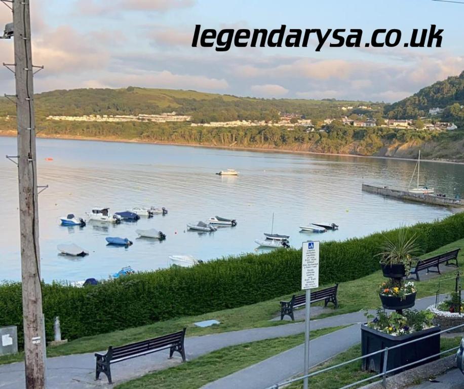 a view of a river with boats in the water at Harbour Lights Apartment New Quay in New Quay