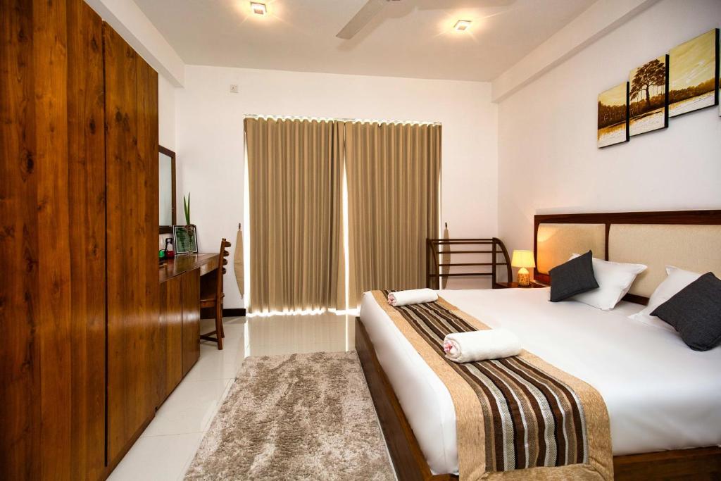 Postel nebo postele na pokoji v ubytování Amandara Hills Kandy