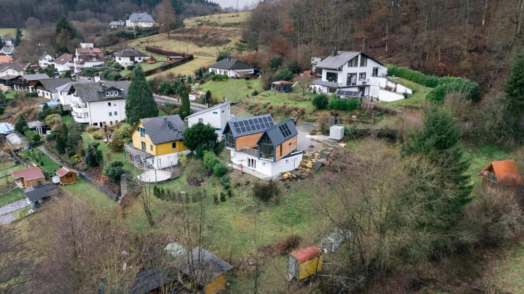 an aerial view of a village with houses on a hill at Taunus Tinyhouse in Weilrod
