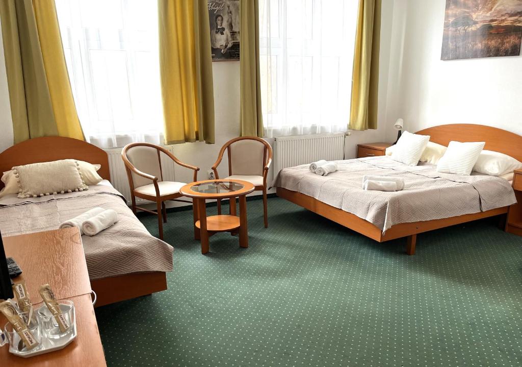 Postel nebo postele na pokoji v ubytování Broadway City Guesthouse